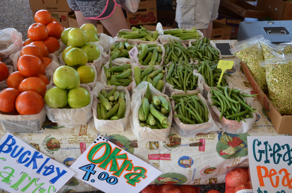 Tomatoes, okra and peas at a local farmers' market. 
