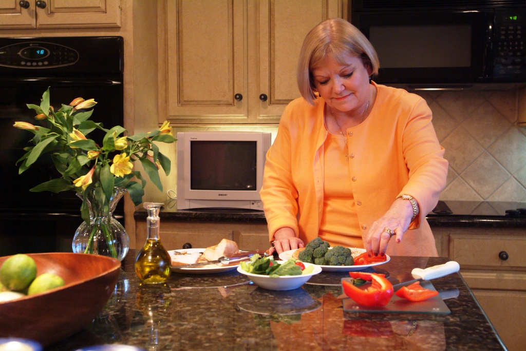 AgriLife photo of woman in kitchen  preparing of fresh produce