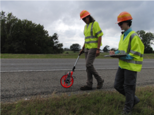 Janice Bovankovich (left) and Kaitlin Lopez (right) walking 100-m monarch roadkill transect on Texas highway 47, College Station, Texas on 28 October, 2019. Photo credit: James Tracy, Department of Entomology