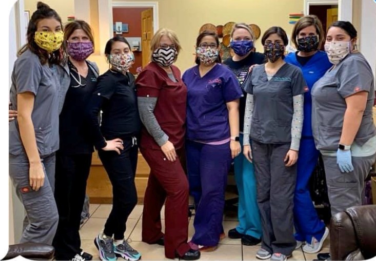 group of healthcare workers  wearing masks