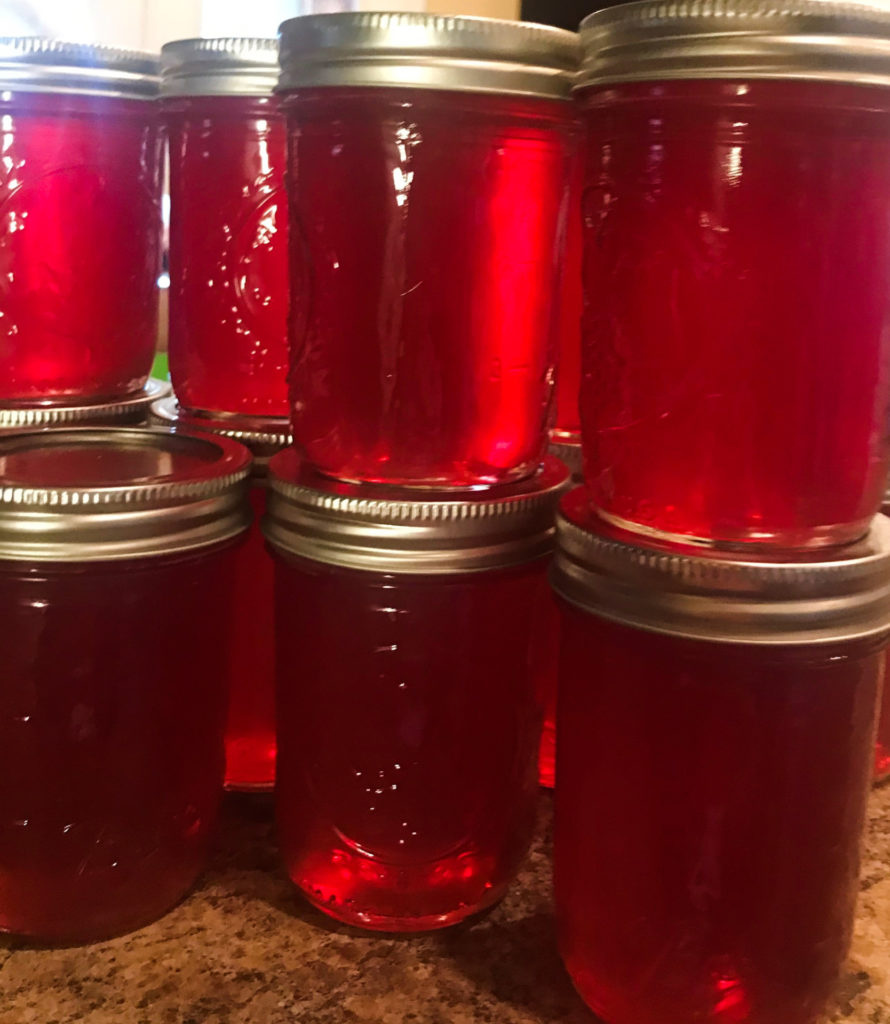 jars of home canned red jelly