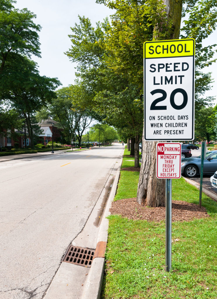 School zone sign on side of road