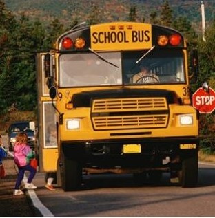 Bus stopping on road for children