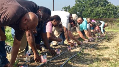 Veterans planting U.S. flags