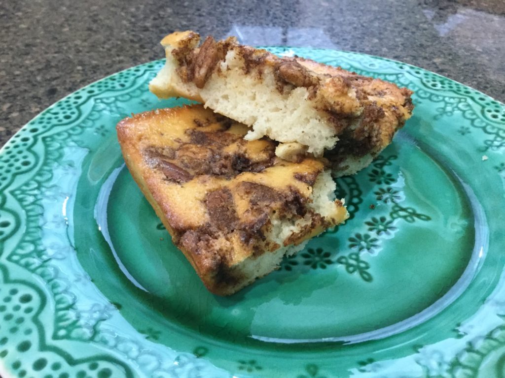 Slices of pecan coffee cake on green plate