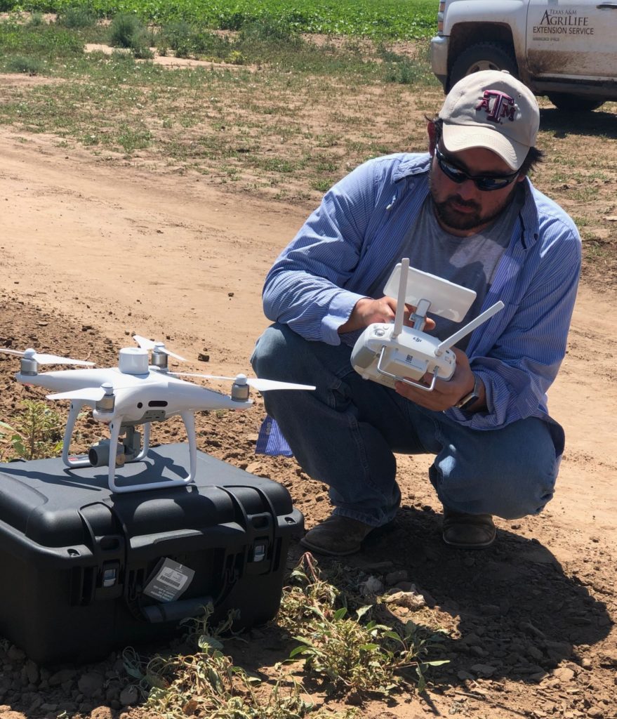 Dr. Murilo Maeda prepares a drone for flight