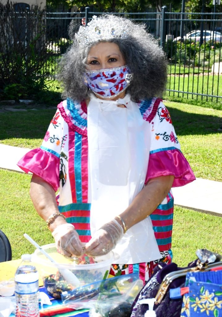 Participant making salsa at Taste of Cinco de Mayo event in San Antonio, 2021.