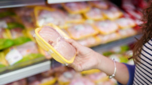 Packaged chicken breasts at grocery store. 