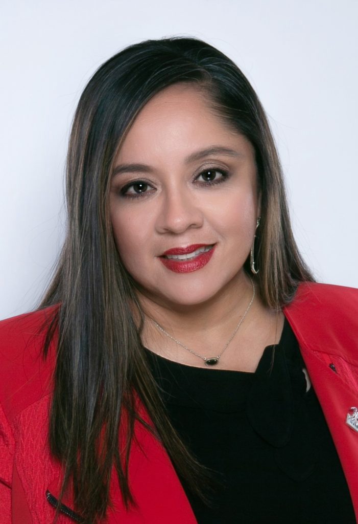 The headshot of a woman dressed in a red jacket - Raquel Rodriguez, AgriLife Extension family and community health agents, Val Verde County.