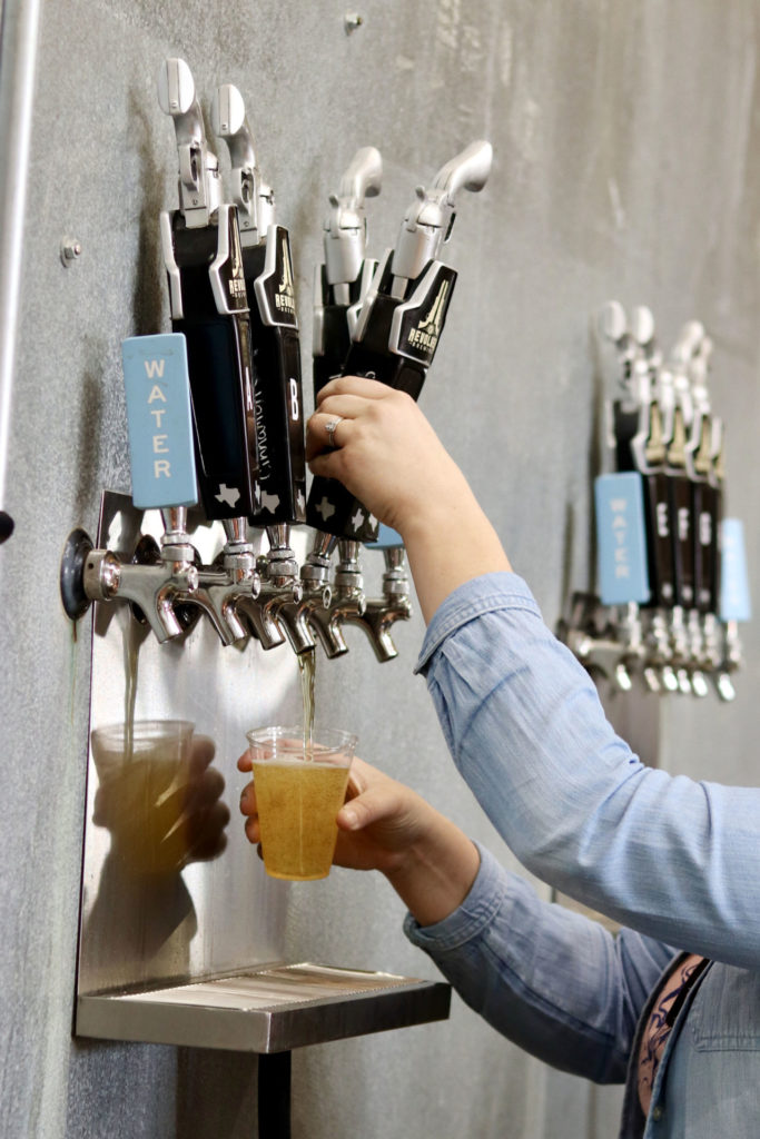 Revolver Brewing beer taps showing company branding. The Revolver Brewing Education Scholarship will help minority and underrepresented students succeed in the brewing industry. 