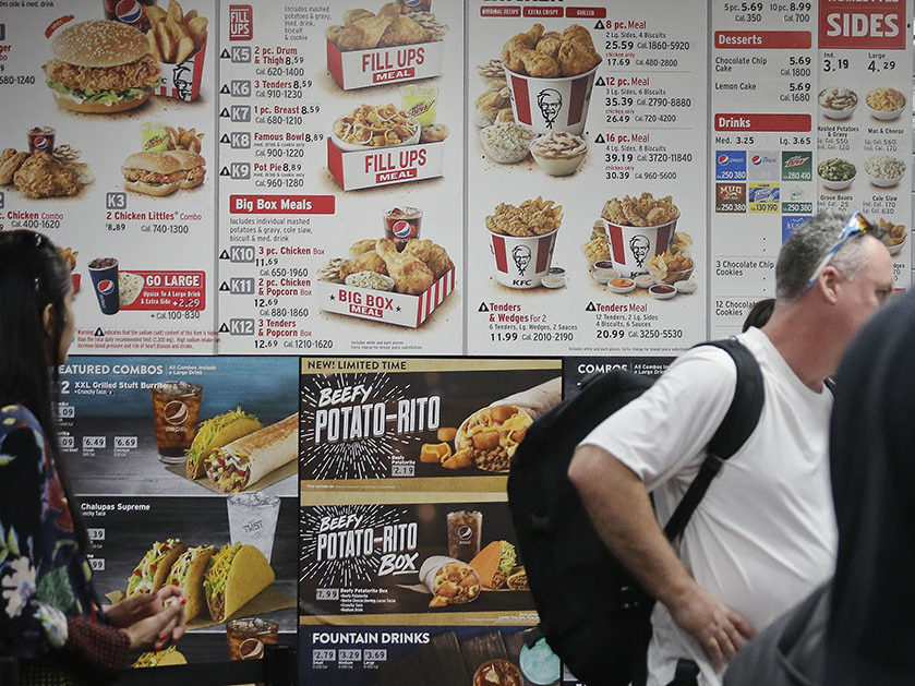 A fast food menu with pictures and descriptions includes the calorie labeling