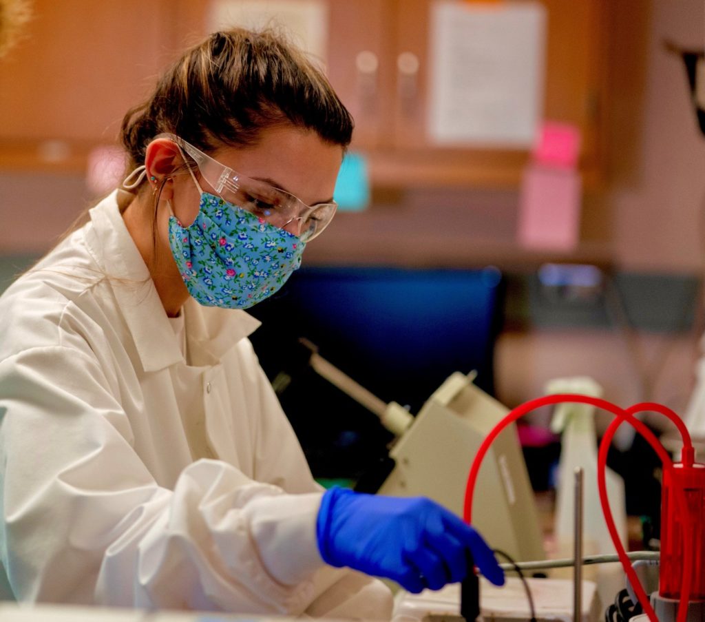 A female doctoral student, Kendall Howie, doing research in the eBeam lab