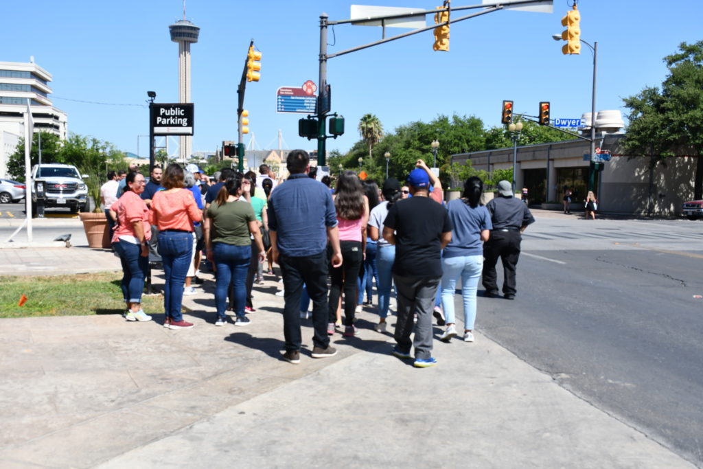 Walk Across Texas participants prepare to cross a street as part of the event kickoff in San Antonio.