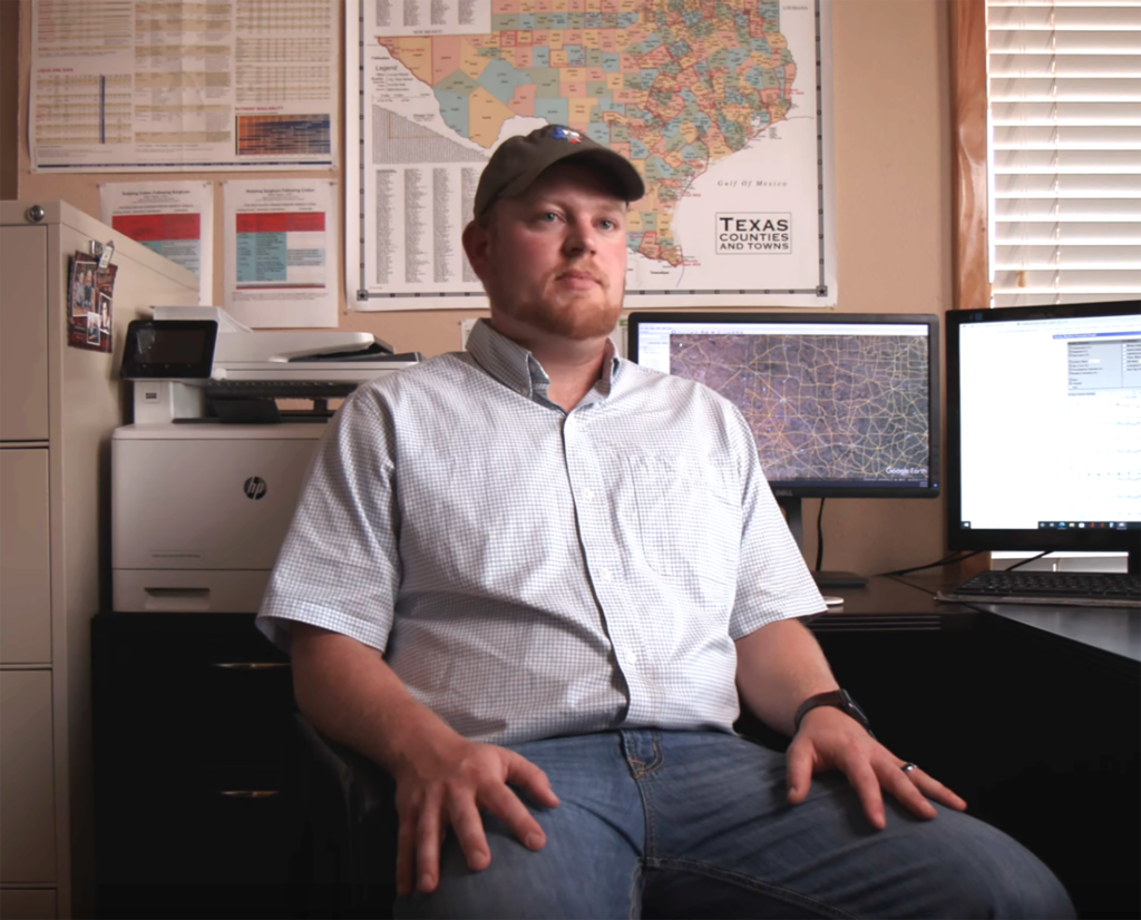 A man, Grant Heinrich, sits in his office chair and talks about mental health in the agriculture field.
