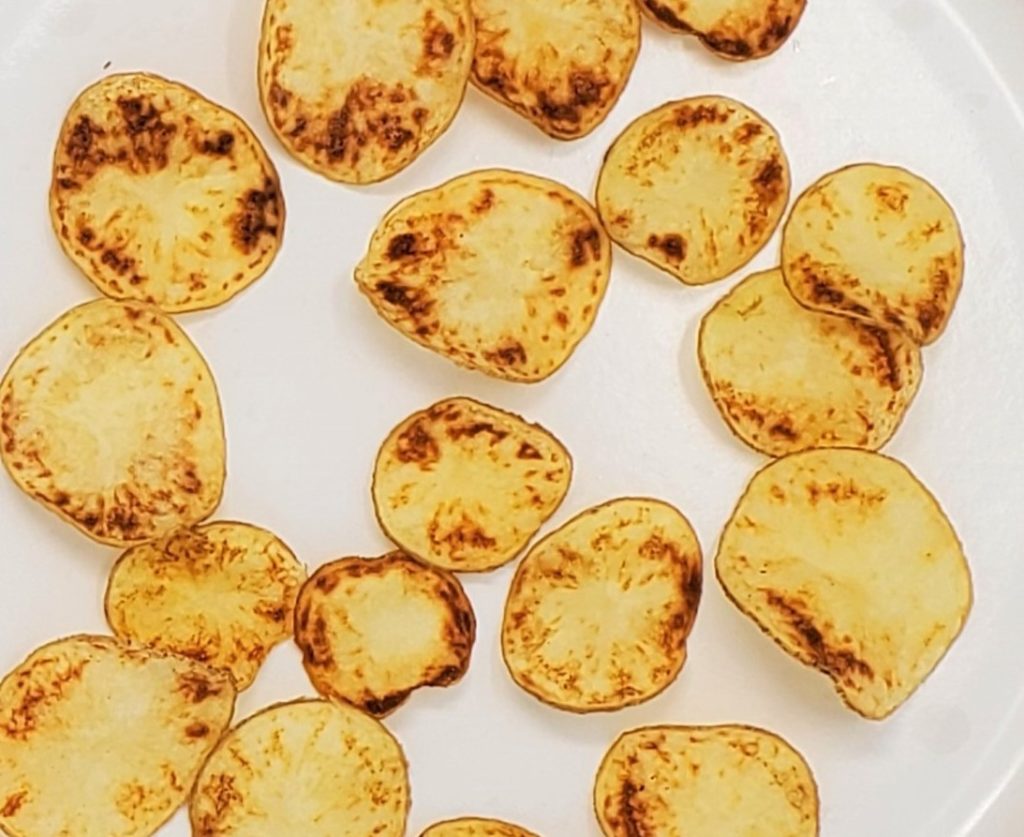 Potato chips from potato tubers affected by zebra chip disease have brown rings and patches when fried. 