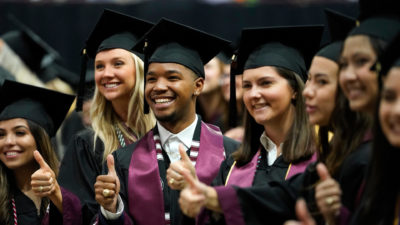 students in caps and gowns graduate from the Texas A&M College of Agriculture and Life Sciences