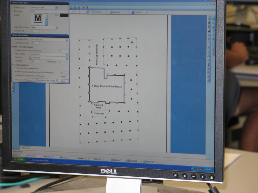 A computer screen showing a CAD irrigation program. It resembles a blue print of a home for irrigation planning.