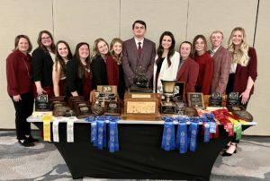 2022 meat judging team and coaches - 10 women and two men - pose with awards
