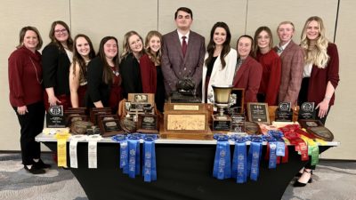 2022 meat judging team and coaches pose with awards