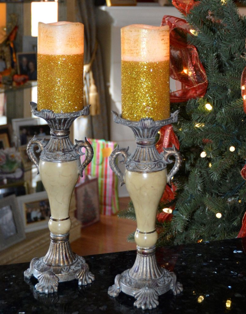 Pair of gold and ivory LED candles set into ornate candleholders