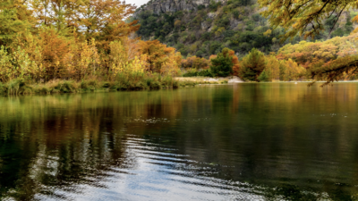 A view of a body of water in the Texas Hill Country during the fall.