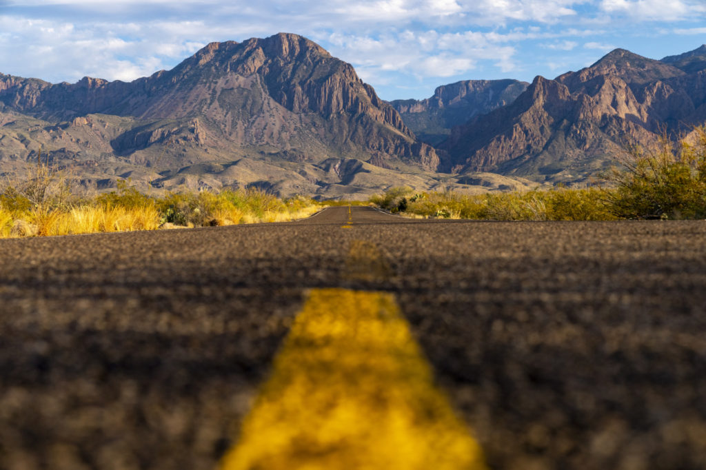 Low view from center of the road toward mountains at Big Bend