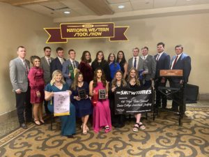 The Texas A&M livestock judging team members and coaches pose with their awards at the National Western Stock Show in Denver.