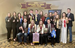 The Texas A&M meat judging team members and coaches pose with their awards at the National Western Stock Show in Denver.