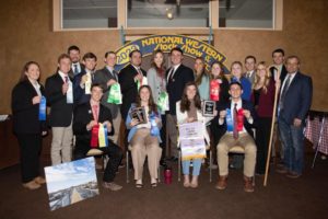 The Texas A&M wool judging team members and coaches pose with their awards at the National Western Stock Show in Denver.