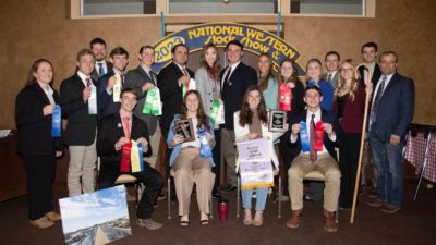 The Texas A&M wool judging team members and coaches pose with their awards at the National Western Stock Show in Denver.