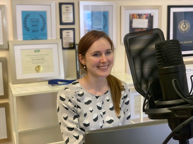 Lauren Cornell, Ph.D, sitting at the desk in her office at NovoThelium 