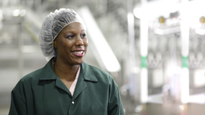 Alicia Walker, Ph.D., during an audit in PPE at a poultry processing facility.