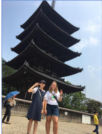 Iori Kimagai, left, and Katelyn Besler in front of a Buddhist temple in Osaka.