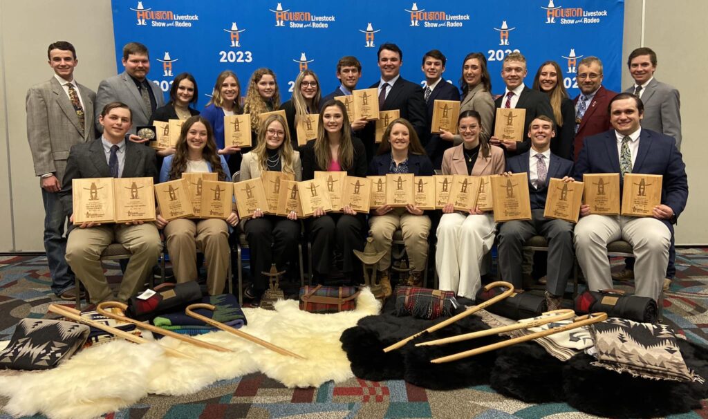 Members of the two Texas A&M wool judging teams pose together with their awards.