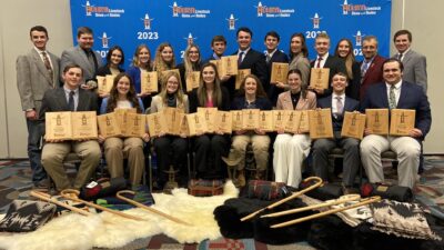 Members of the two Texas A&M wool judging teams pose together with their awards.