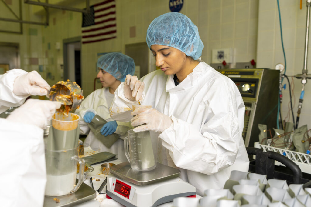 Student preparing space food at the Space Food Research Facility in the Texas A&M campus