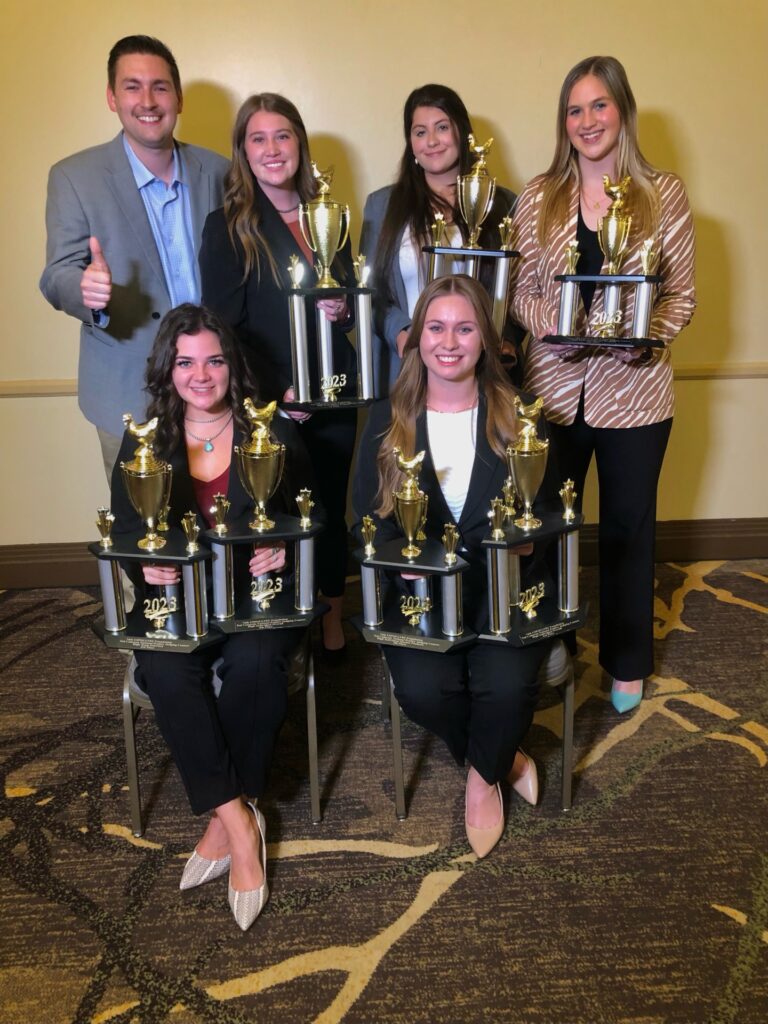 The poultry judging students shown holding their trophies from the national poultry contest. 