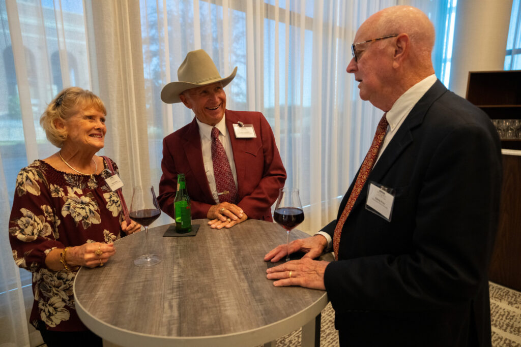 Larry and Pam Leschber chat with Edwin Price during the Legacy and Leadership annual banquet.