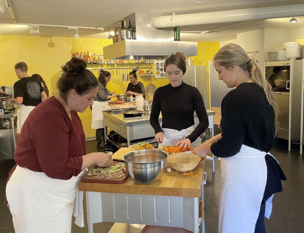 Students preparing food during a Swiss cooking class