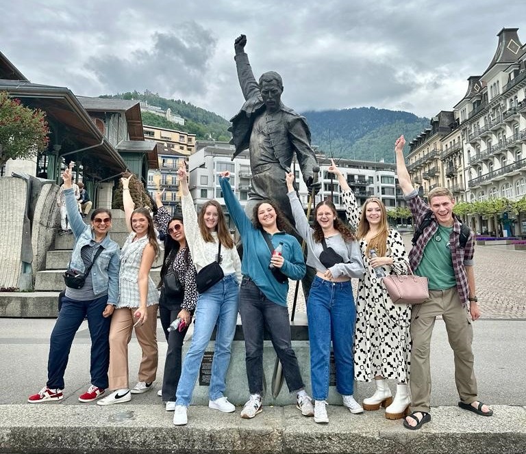 Students in front of statue of Freddy Mercury in Montreaux.