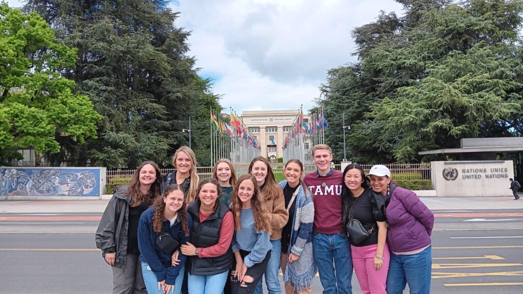 Group of TAMU students in front of United Nations building in Geneva. 