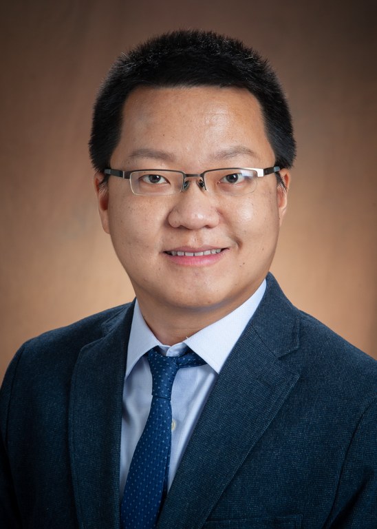 Head and shoulder photo of Xudong Rao, Ph.D., in a blue sport coat with a light blue shirt and dark blue tie. Agricultural innovation is a major focus for the new research associate professor in Department of Agricultural Ecomonics
