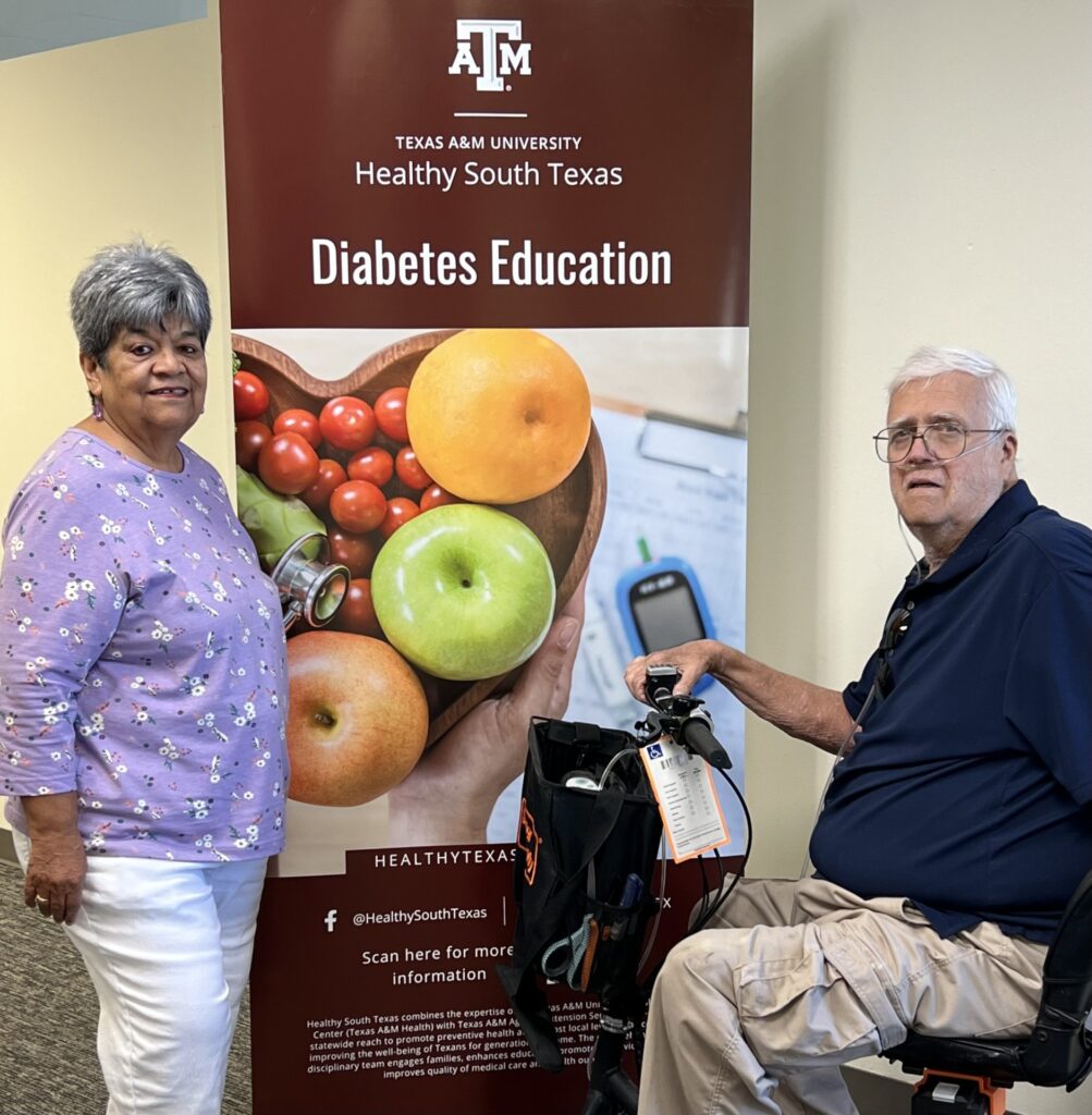 Lupe Ovalle and Donald D'Entremont standing on either side of Healthy South Texas Diabetes Education pop-up banner.   