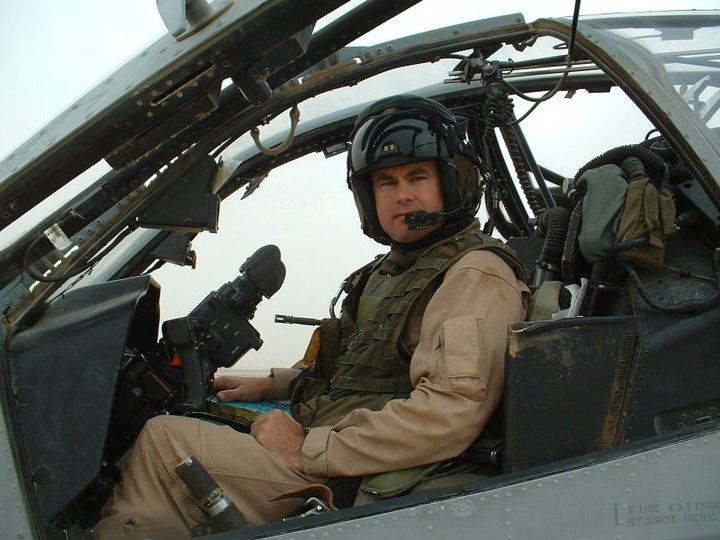 Russell McGee in the cockpit of an AH-1W Cobra helicopter during his military career.