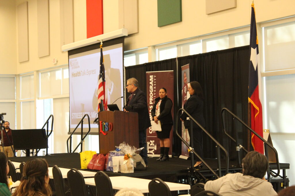 Presenters from the Texas A&M Colonias Program and Health South Texas on the stage at the Your Health Matters! Wellness Conference