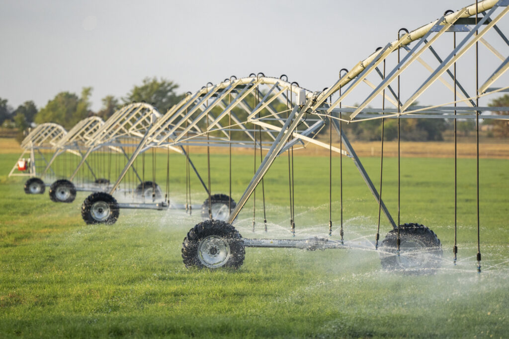 A pivot irrigation system watering a field. 