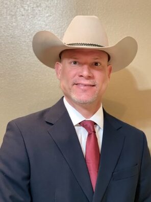 a man in a cowboy hat, Carlos Garza