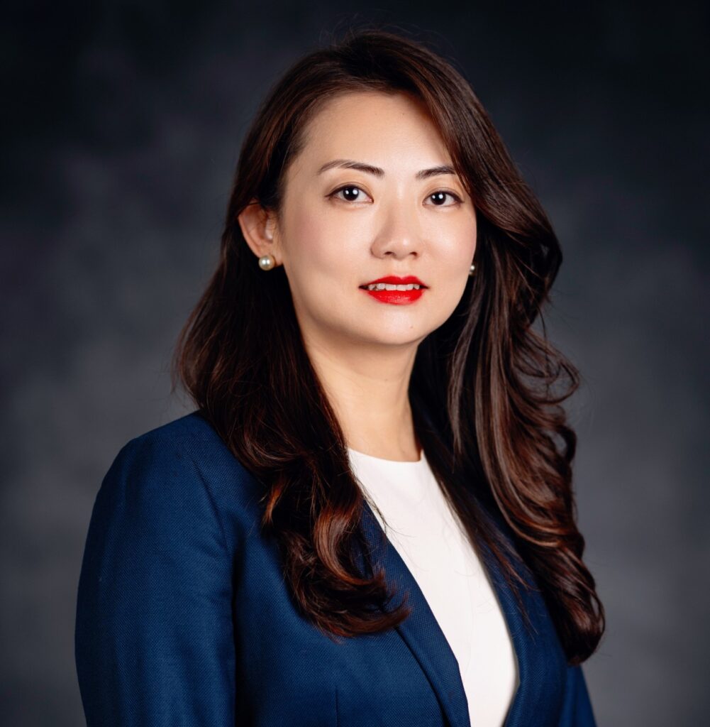 Headshot of a woman, Wen Chang, Ph.D. She is wearing a blue jacket with a white shirt. 