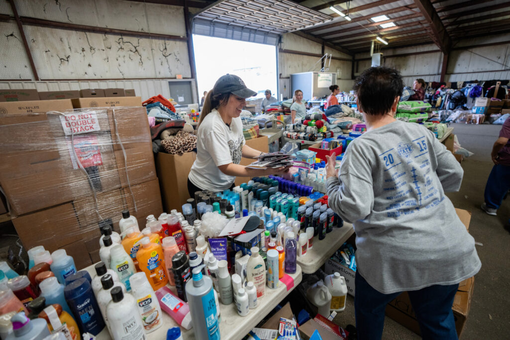 TOiletries by the hundreds are sorted by two volunteers at the supply point for human disaster relief in Hemphill County