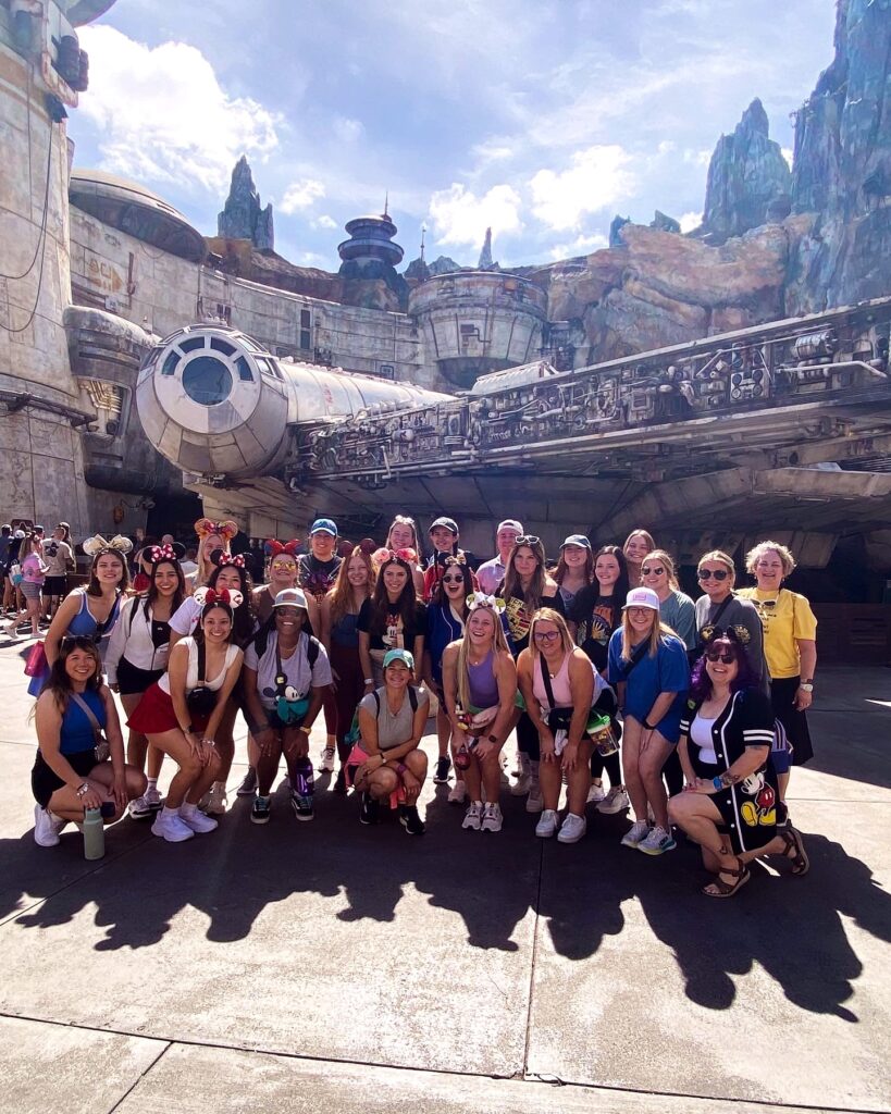 Group photo of the Disney Week participants from Texas A&M. The large group is standing in front of the entrance to the Star Wars: Galaxy Edge experience